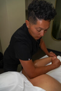 The therapist hands massaging pregnant woman,for treat and relax program,at spa therapy By Watcharin